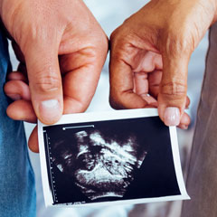 Couple holding ultrasound